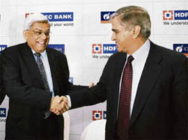 HDFC chairman Deepak Parekh (L) greets chairman of Centurion Bank of Punjab Rana Talwar, in Mumbai on Monday.