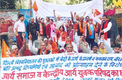 Arya Samajists hold a dharna to protest against references to Ram and the Vedas in a history book of Delhi University, at Jantar Mantar in the Capital