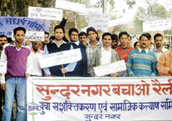Residents take out a silent procession demanding the shifting of the proposed cement plant site in Sundernagar