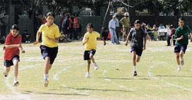 Girls take part in a race during the athletics meet in YPS, Mohali, on Tuesday.