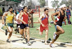 Athletes take part in 800m race on the inaugural day of the 132nd Annual Sports Meet of Government Mohindra College in Patiala on Tuesday