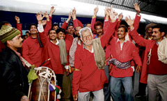 Porters in a jubilant mood at the Jammu railway station after Union Railway Minister Lalu Prasad Yadav announced to promote them as gangmen on Tuesday.