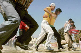 Students of Arya College participate in a three-legged race during their annual athletics meet in Ludhiana on Tuesday.