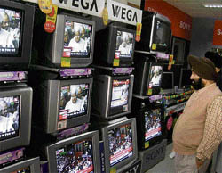 TV sets show railway minister Lalu Prasad Yadav presenting the Railway Budget in Parliament at a showroom in Amritsar on Tuesday.