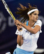Sania Mirza returns the ball in a doubles match at the WTA Dubai Open on Monday. 
