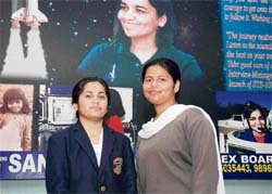 Gunjan Budhiraja from Bhiwani (left) and Somya Chaudhary from Karnal of Tagore Baal Niketan Senior Secondary School, who have been selected to represent India at the first summer session of the United Space School Foundation at Houston, Texas, USA, in Karnal on Wednesday.