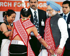 Prime Minister Manmohan Singh wearing traditional warrior dress of the Angami Naga tribe during an election rally at Kohima in Nagaland.