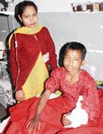 Mamta of Bahadurgarh, who was allegedly thrashed by her stepfather, undergoes treatment at the PGIMS in Rohtak on Thursday. 