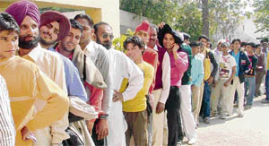 Candidates form a queue outside the Punjabi Bhawan in Ludhiana on Thursday.