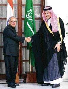 Saudi Arabias foreign minister Prince Saud al-Faisal shakes hands with his Indian counterpart Pranab Mukherjee before their meeting in New Delhi