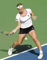 Russias Svetlana Kuznetsova hits a return to Frances Amelie Mauresmo during the quarterfinal of the Dubai Open
