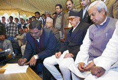 Madheshi leader Upendra Yadav (left) signs a deal as Prime Minister Girija Prasad Koirala (centre) and another Madheshi leader Mahantha Thakur look on in Kathmandu on Thursday.