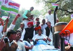 Outer Delhi MP Sajjan Kumar along with Deepender Singh Hooda, MP, and farmers from Haryana drive towards UPA chairperson Sonia Gandhis residence in the Capital on Friday to congratulate her after the Budget presentation. 