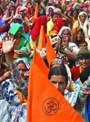 Women shout slogans during the Sant Sammelan on Save Ganga at Ram Lila Ground in the Capital on Friday.