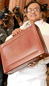 Finance minister P. Chidambaram arrives at the Parliament House to present the budget for the year 2008-09 in New Delhi on Friday.