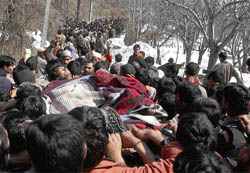 Kashmiris carry bodies of four militants killed in a gunbattle with the security forces in Saidpora village in Shopian, about 70 km from Srinagar, on Friday.