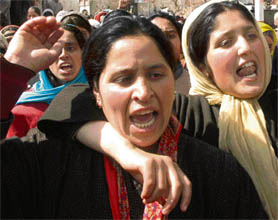 Kashmiri women mourn the death of militants. 