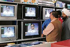 People hooked to TV sets as the finance minister P. Chidambaram presents the Union Budget on Friday.