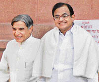 Finance minister P. Chidambaram with minister of state for finance Pawan Kumar Bansal come out of North Block to present the Budget (2008-09) in Parliament on Friday.