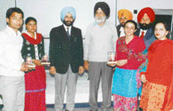 Prize winners of the quiz contest being honoured by director and principal of Guru Nanak National College, Doraha
