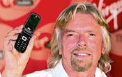 Virgin Group chairman Richard Branson holds a mobile phone at the launch of Virgin mobile services in Mumbai on Sunday.
