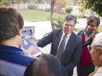Banarsi Lal Chawla, father of Kalpana Chawla, with a photograph of the late astronaut at Fatehabad on Sunday.