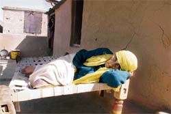 A Rajouri migrant, waiting for relief in her makeshift hut in Jammu.
