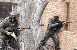 Soldiers take up position during a gun battle in Chewdara on Sunday