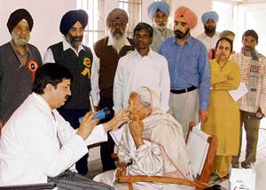 An eye-specialist examines a patient at a medical camp organised by the Senior Sikh Budhijivi Council in Ludhiana on Sunday. 