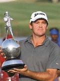 Mark Brown of New Zealand poses with the trophy after winning the Johnnie Walker Classic golf tournament in Gurgaon on Sunday.