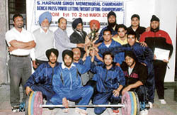 The winners display their trophy after S. Harnam Singh Memorial Chandigarh Bench Press Powerlifting Championship held at Weightlifting Coaching Centre (WCC), Sector 42, Chandigarh,
