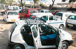 Vehicles parked on the main road leading to the domestic terminal building of the Chandigarh