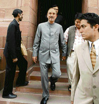 Jammu and Kashmir Chief Minister Ghulam Nabi Azad (C) leaves Parliament House in New Delhi on Monday.