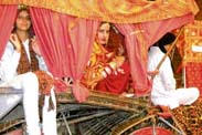 A student draped in bridal attire