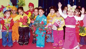 Tiny tots of Lovely Lotus School being introduced to types of flowers in Ludhiana on Monday. 