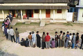 Villagers queue as they wait to cast their votes for the Meghalaya assembly elections at a polling station in Rangsakona, 80 km from Shillong