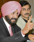 BJP MP from Amritsar Navjot Singh Sidhu at a press conference in Chandigarh on Monday.