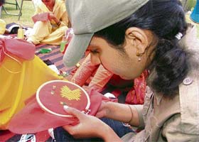 A student takes part in Phulkari embroidery competition organised at the PAU, Ludhiana