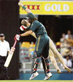 Andrew Symonds brings down a streaker during the second final of the triangular series against India in Brisbane