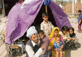 Jamuna Prasads family outside their hutment in Mansa Devi in Panchkula on Tuesday.