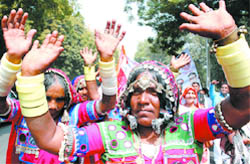 Members of the Banzara Kranti Dal demand facilities as enjoyed by them in Maharashtra, on their way to Parliament in the Capital