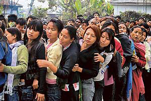 Young women wait for their turn to cast their votes in Nagaland Assembly elections in Dimapur on Wednesday.