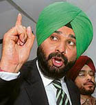 Amritsar MP Navjot Singh Sidhu addresses a press conference in New Delhi on Wednesday.