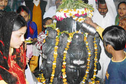 Devotees perform parikrama of the Shivling on the occasion of Mahashivratri in Ambala