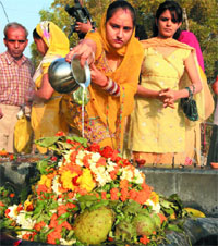 Devotees anoint a Shivalinga with milk on the Mahashivaratri festival in the Capital on Thursday.