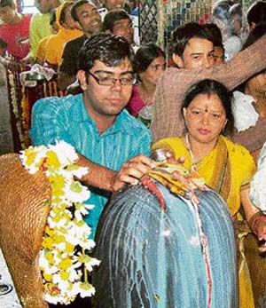 Devotees offer prayers on the occasion of Mahashivratri in Gurgaon on Thursday.