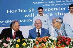 (From left) Punjab and Haryana High Court Chief Justice Vijender Jain, union minister for law H.R. Bhardwaj and Haryana Chief Minister Bhupinder Singh Hooda at the inauguration of a judicial complex at Jhajjar on Thursday. 