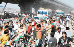 In this file picture of a political rally, activists block the GT Road to give a rousing welcome to a VVIP in Panipat