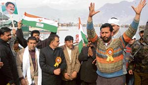 Congress workers during a boat rally at Dal Lake in Srinagar on Thursday.