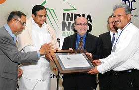 President of Deepalaya and Senior Associate Editor of The Tribune A.J. Philip receives the Best NGO of the Northern region award from union finance minister P. Chidambaram, in New Delhi on Wednesday. Also seen is Infosys chairman and chief mentor N.R. Narayanamurthy(L)